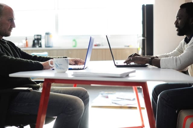 Two men working at a table